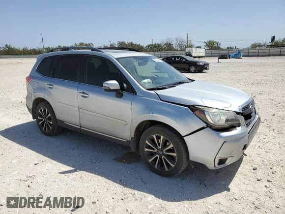 2017 Subaru Forester Touring z VIN JF2SJGWC2HH431342, wystawiony jako Copart lot #50216305 z przebiegiem 123 995 mil mil oraz Szkoda całkowita • Salvage title. Historia ofert i sprzedaży dostępna na DreamBid. Obrazek 4.