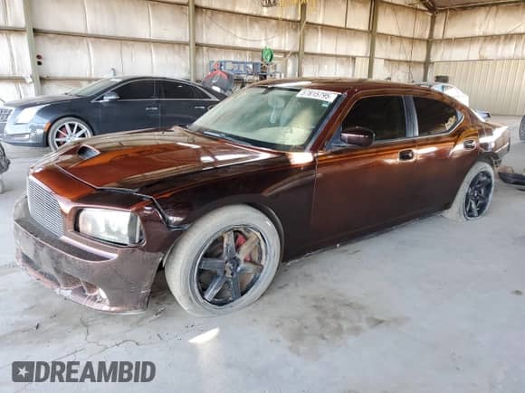 2006 Dodge Charger SRT-8 с VIN 2B3KA73W16H385931, выставлен на аукционе Copart как лот 57815795 с пробегом 125 706 миль миль и Списание • Salvage title. История ставок и продаж доступна на DreamBid. Изображение 1.