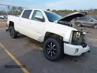 2017 Chevrolet Silverado 1500 LT z VIN 3GCUKREC1HG355933, wystawiony jako IAAI lot #41465680 z przebiegiem 151 477 mil mil oraz . Historia ofert i sprzedaży dostępna na DreamBid. Obrazek 1.
