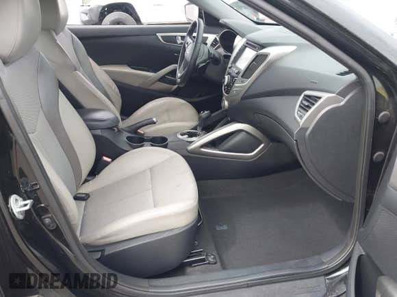 2013 Hyundai Veloster w/Black Int with VIN KMHTC6AD0DU106306, listed as a IAAI auction lot 43409235 with 82,350 mi miles and . Bid and sale history available at DreamBid. Image 5.