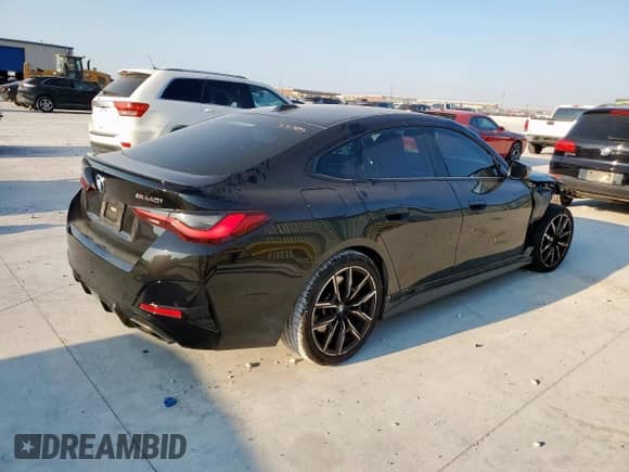 2022 BMW 4 Series M440i xDrive с VIN WBA13AW00NFM45784, выставлен на аукционе Copart как лот 80872155 с пробегом 23 333 миль миль и Списание • Salvage title. История ставок и продаж доступна на DreamBid. Изображение 3.