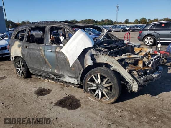 2021 Honda Pilot Elite с VIN 5FNYF6H03MB084346, выставлен на аукционе Copart как лот 87102845 с пробегом Не указан миль и На запчасти • Non repairable. История ставок и продаж доступна на DreamBid. Изображение 4.