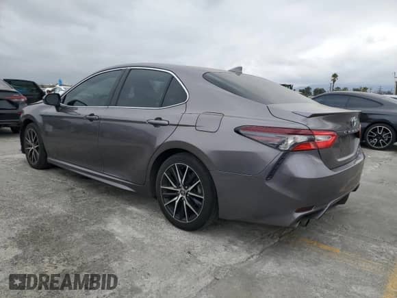 2023 Toyota Camry Hybrid SE with VIN 4T1S31AKXPU055821, listed as a Copart auction lot 84012145 with 148,408 mi miles and Salvage title. Bid and sale history available at DreamBid. Image 2.