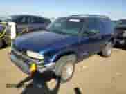 2001 Chevrolet Blazer LS z VIN 1GNCT18W91K189599, wystawiony jako Copart lot #74595674 z przebiegiem 208 309 mil mil oraz Szkoda całkowita • Salvage title. Historia ofert i sprzedaży dostępna na DreamBid. Obrazek 1.