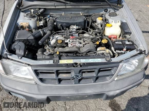 1999 Subaru Forester L with VIN JF1SF6353XH727555, listed as a Copart auction lot 80185275 with 186,950 mi miles and Salvage title. Bid and sale history available at DreamBid. Image 12.