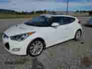 2012 Hyundai Veloster w/Gray Int z VIN KMHTC6AD0CU056764, wystawiony jako Copart lot #84646725 z przebiegiem 157 456 mil mil oraz Czysty tytuł • Clean title. Historia ofert i sprzedaży dostępna na DreamBid. Obrazek 1.