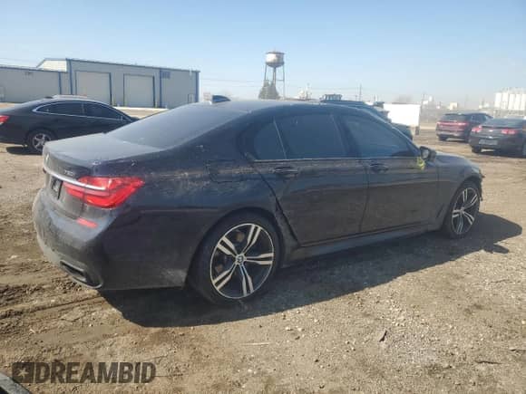 2016 BMW 7 Series 750i xDrive with VIN WBA7B0C51GG526703, listed as a Copart auction lot 48690465 with 73,853 mi miles and Salvage title. Bid and sale history available at DreamBid. Image 3.