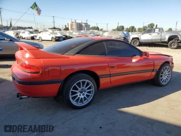 1991 Dodge Stealth with VIN JB3XD44SXMY018827, listed as a Copart auction lot 79144264 with 104,140 mi miles and Salvage title. Bid and sale history available at DreamBid. Image 3.