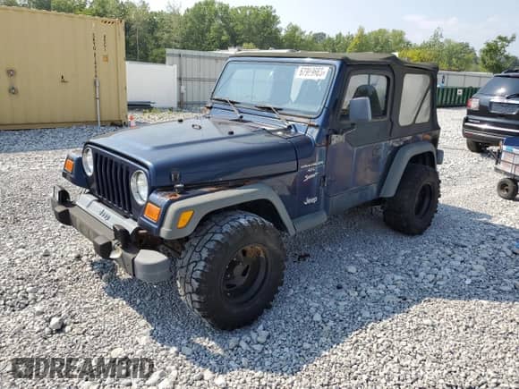 2000 Jeep Wrangler Sport with VIN 1J4FA49S5YP744967, listed as a Copart auction lot 67909665 with 141,990 mi miles and Clean title. Bid and sale history available at DreamBid. Image 1.