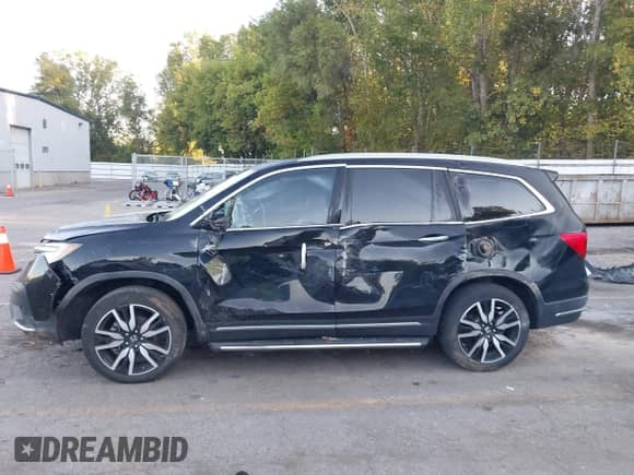 2020 Honda Pilot Touring 8-Passenger с VIN 5FNYF5H94LB009548, выставлен на аукционе IAAI как лот 43338596 с пробегом 46 151 миль миль и . История ставок и продаж доступна на DreamBid. Изображение 14.