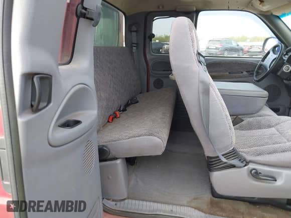 1998 Dodge 1500 z VIN 1B7HF13Y5WJ180264, wystawiony jako IAAI lot #41858346 z przebiegiem 117 340 mil mil oraz . Historia ofert i sprzedaży dostępna na DreamBid. Obrazek 8.