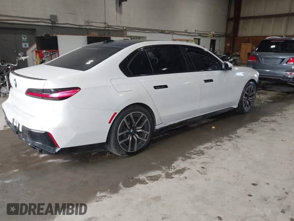 2023 BMW 7 Series 760i xDrive with VIN WBA33EJ01PCM24809, listed as a IAAI auction lot 43310239 with 31,704 mi miles and . Bid and sale history available at DreamBid. Image 4.