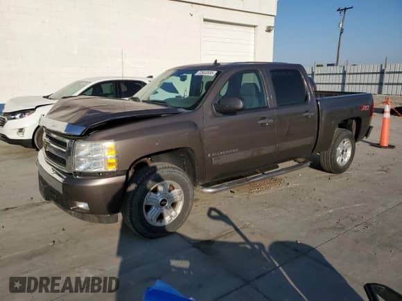 2008 Chevrolet Silverado 1500 LTZ with VIN 2GCEK13M981163623, listed as a Copart auction lot 70932835 with 158,096 mi miles and Salvage title. Bid and sale history available at DreamBid. Image 1.