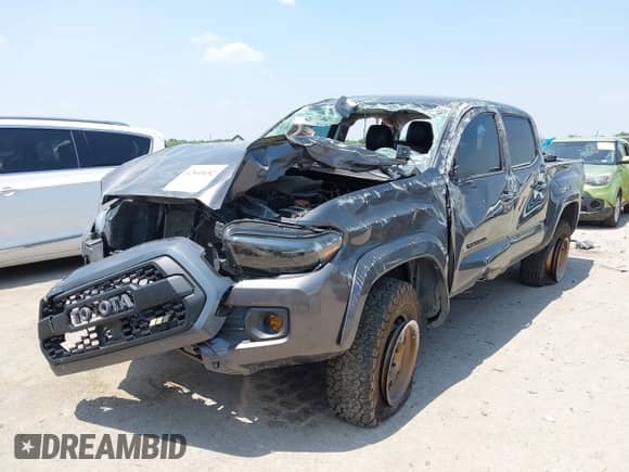 2021 Toyota Tacoma SR5 with VIN 5TFAZ5CN1MX118036, listed as a IAAI auction lot 42840652 with 73,082 mi miles and . Bid and sale history available at DreamBid. Image 2.
