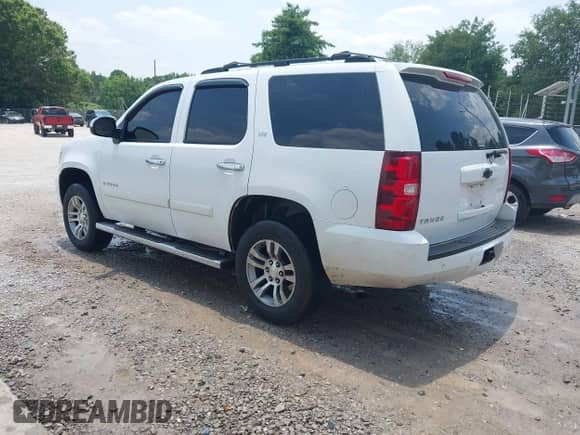 2007 Chevrolet Tahoe LTZ with VIN 1GNFC13JX7R256106, listed as a IAAI auction lot 42490456 with 436,354 mi miles and . Bid and sale history available at DreamBid. Image 3.