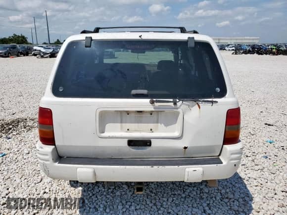 1998 Jeep Grand Cherokee Limited с VIN 1J4GZ78Y4WC112941, выставлен на аукционе Copart как лот 66895995 с пробегом Не указан миль и Списание • Salvage title. История ставок и продаж доступна на DreamBid. Изображение 6.