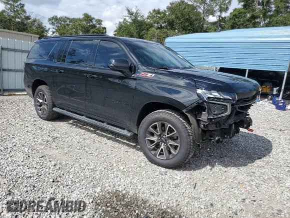 2021 Chevrolet Suburban Z71 with VIN 1GNSKDKD5MR190008, listed as a Copart auction lot 83961935 with 116,494 mi miles and Salvage title. Bid and sale history available at DreamBid. Image 4.
