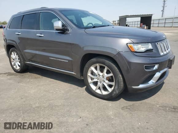 2014 Jeep Grand Cherokee Summit with VIN 1C4RJFJT6EC481846, listed as a Copart auction lot 71051545 with 216,706 mi miles and Salvage title. Bid and sale history available at DreamBid. Image 4.