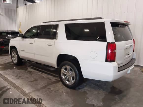 2017 Chevrolet Suburban LT with VIN 1GNSKHKC9HR300742, listed as a IAAI auction lot 43459656 with 99,296 mi miles and . Bid and sale history available at DreamBid. Image 3.