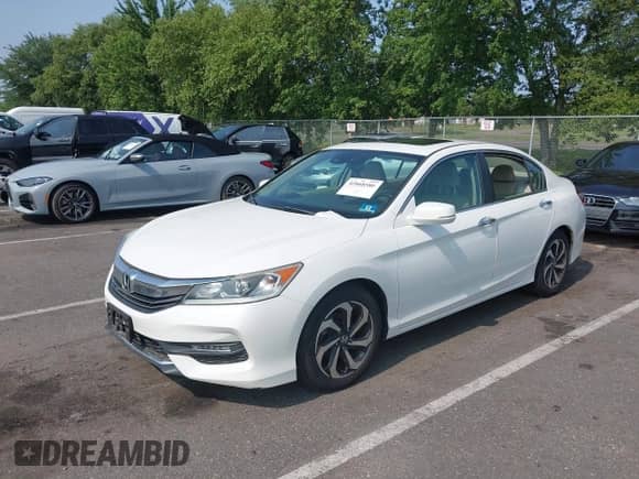 2016 Honda Accord EX-L with VIN 1HGCR2F98GA053233, listed as a IAAI auction lot 42868580 with 124,554 mi miles and . Bid and sale history available at DreamBid. Image 2.