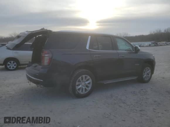 2023 Chevrolet Tahoe Premier with VIN 1GNSCSKD4PR563710, listed as a Copart auction lot 84965394 with 17,528 mi miles and Salvage title. Bid and sale history available at DreamBid. Image 3.