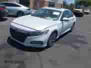 2020 Honda Accord Touring with VIN 1HGCV3F90LA014020, listed as a IAAI auction lot 42397495 with 81,410 mi miles and . Bid and sale history available at DreamBid. Image 2.