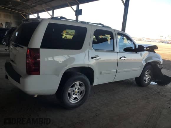 2007 Chevrolet Tahoe LS z VIN 1GNFC13007J380164, wystawiony jako Copart lot #84642765 z przebiegiem Nie podano mil oraz Szkoda całkowita • Salvage title. Historia ofert i sprzedaży dostępna na DreamBid. Obrazek 3.