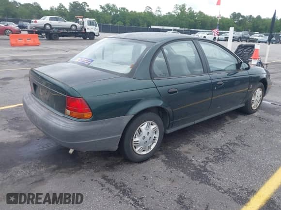 1998 Saturn SL с VIN 1G8ZH5280WZ295857, выставлен на аукционе IAAI как лот 42238789 с пробегом 153 163 миль миль и . История ставок и продаж доступна на DreamBid. Изображение 4.