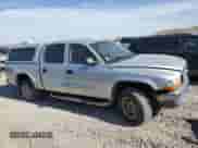 2004 Dodge Dakota SLT with VIN 1D7HG48N94S720659, listed as a Copart auction lot 62123465 with 212,809 mi miles and Salvage title. Bid and sale history available at DreamBid. Image 4.