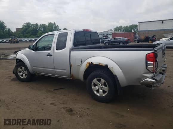 2009 Nissan Frontier SE with VIN 1N6AD06W79C408699, listed as a Copart auction lot 58698925 with 118,451 mi miles and Salvage title. Bid and sale history available at DreamBid. Image 2.