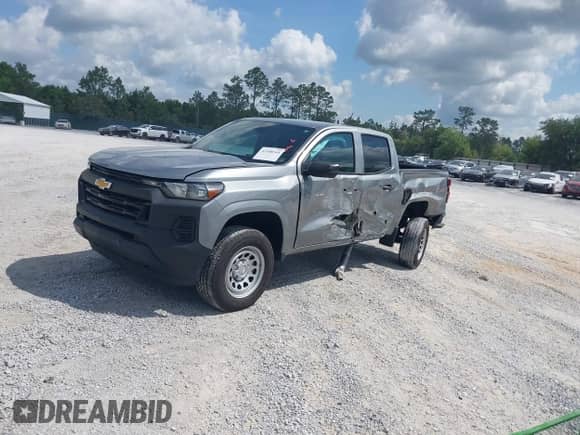 2023 Chevrolet Colorado 4WD Work Truck z VIN 1GCPTBEK7P1112228, wystawiony jako IAAI lot #42308344 z przebiegiem 12 668 mil mil oraz . Historia ofert i sprzedaży dostępna na DreamBid. Obrazek 2.
