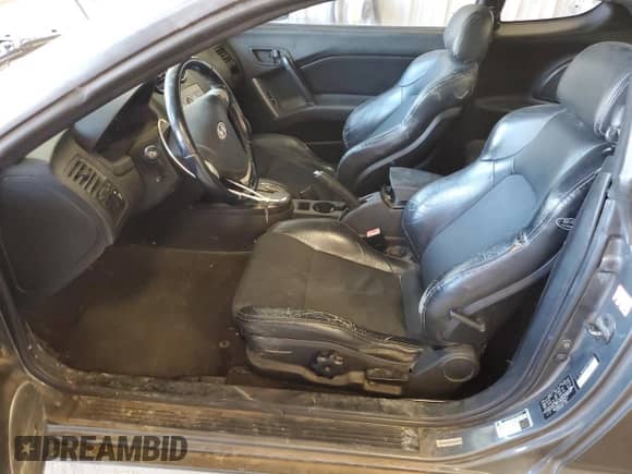 2007 Hyundai Tiburon GT с VIN KMHHN66F47U253212, выставлен на аукционе Copart как лот 85019734 с пробегом 200 172 миль миль и Списание • Salvage title. История ставок и продаж доступна на DreamBid. Изображение 7.