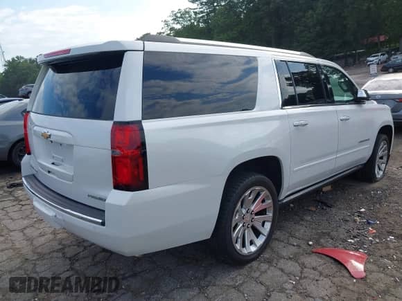 2019 Chevrolet Suburban Premier with VIN 1GNSCJKC9KR126778, listed as a IAAI auction lot 42675554 with 164,489 mi miles and . Bid and sale history available at DreamBid. Image 4.