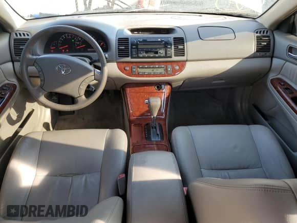 2005 Toyota Camry LE с VIN JTDBF32K750162836, выставлен на аукционе Copart как лот 81082105 с пробегом 131 582 миль миль и Списание • Salvage title. История ставок и продаж доступна на DreamBid. Изображение 8.