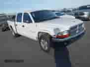 2002 Dodge Dakota SLT with VIN 1B7HL48NX2S518299, listed as a IAAI auction lot 41414659 with 220,943 mi miles and . Bid and sale history available at DreamBid. Image 1.