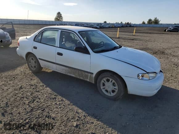 1998 Chevrolet Prizm with VIN 1Y1SK5284WZ433758, listed as a Copart auction lot 49698725 with 123,154 mi miles and Salvage title. Bid and sale history available at DreamBid. Image 4.