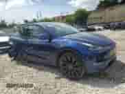 2022 Tesla Model Y Performance with VIN 7SAYGDEF6NF455028, listed as a Copart auction lot 61740254 with 26,869 mi miles and Salvage title. Bid and sale history available at DreamBid. Image 4.