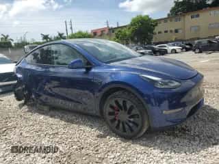 2022 Tesla Model Y Performance with VIN 7SAYGDEF6NF455028, listed as a Copart auction lot 61740254 with 26,869 mi miles and Salvage title. Bid and sale history available at DreamBid. Image 4.