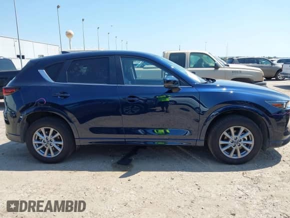 2025 Mazda CX-5 S Select z VIN JM3KFBBL3S0677855, wystawiony jako IAAI lot #43183580 z przebiegiem 6 185 mil mil oraz . Historia ofert i sprzedaży dostępna na DreamBid. Obrazek 13.
