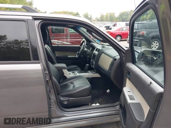 2010 Mercury Mariner Premier with VIN 4M2CN9H70AKJ30462, listed as a IAAI auction lot 43264181 with 169,789 mi miles and . Bid and sale history available at DreamBid. Image 5.