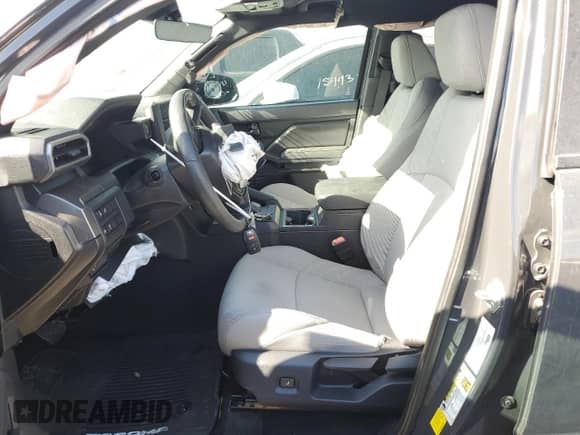 2024 Toyota Tacoma SR5 with VIN 3TMLB5JN0RM071045, listed as a Copart auction lot 70163855 with 8,616 mi miles and Salvage title. Bid and sale history available at DreamBid. Image 7.