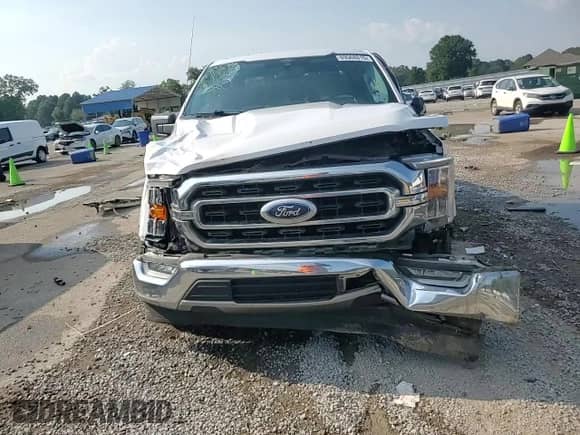 2021 Ford F-150 XL z VIN 1FTEW1C52MFB01397, wystawiony jako Copart lot #69568815 z przebiegiem 112 903 mil mil oraz Szkoda całkowita • Salvage title. Historia ofert i sprzedaży dostępna na DreamBid. Obrazek 13.