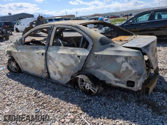 2013 Chevrolet Sonic LT с VIN 1G1JD5SH7D4185521, выставлен на аукционе Copart как лот 53446475 с пробегом Не указан миль и На запчасти • Non repairable. История ставок и продаж доступна на DreamBid. Изображение 2.
