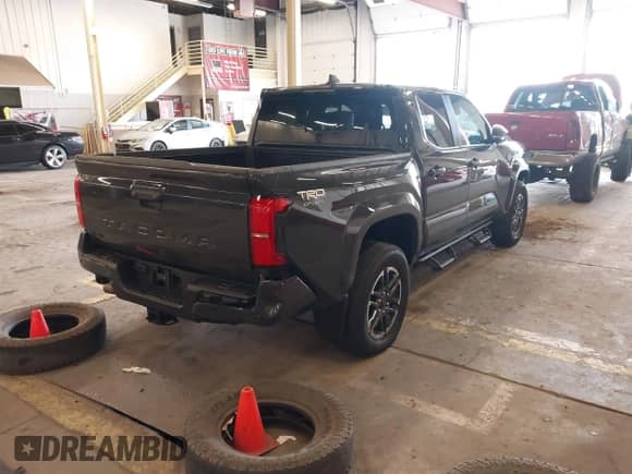 2024 Toyota Tacoma SR5 with VIN 3TMLB5JN9RM067351, listed as a IAAI auction lot 41529043 with 3,054 mi miles and . Bid and sale history available at DreamBid. Image 4.