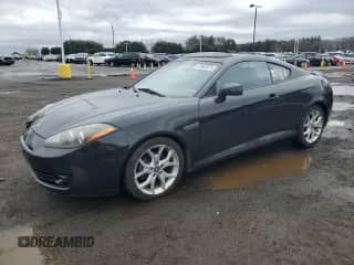 2007 Hyundai Tiburon GT с VIN KMHHN66F47U251685, выставлен на аукционе Copart как лот 47943575 с пробегом 87 848 миль миль и Списание • Salvage title. История ставок и продаж доступна на DreamBid. Изображение 1.