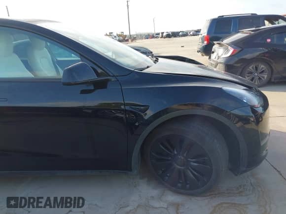 2023 Tesla Model Y Long Range z VIN 7SAYGAEE7PF767951, wystawiony jako IAAI lot #43128878 z przebiegiem 36 431 mil mil oraz . Historia ofert i sprzedaży dostępna na DreamBid. Obrazek 20.