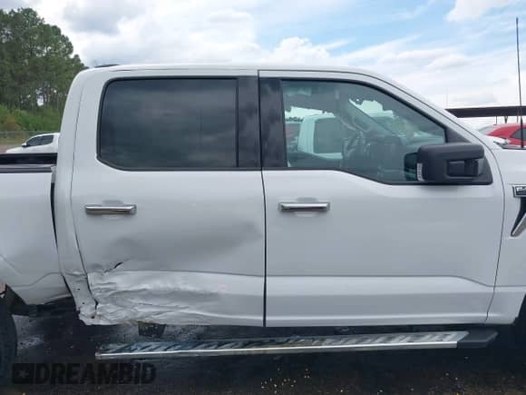 2023 Ford F-150 XL with VIN 1FTFW1E57PKD28761, listed as a IAAI auction lot 43329105 with 26,076 mi miles and . Bid and sale history available at DreamBid. Image 13.