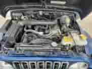 2003 Jeep Wrangler X z VIN 1J4FA39S33P356428, wystawiony jako Copart lot #70285135 z przebiegiem 147 788 mil mil oraz Szkoda całkowita • Salvage title. Historia ofert i sprzedaży dostępna na DreamBid. Obrazek 11.