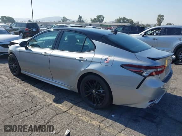 2023 Toyota Camry Hybrid XSE with VIN 4T1K31AK0PU051132, listed as a IAAI auction lot 42945793 with 48,781 mi miles and . Bid and sale history available at DreamBid. Image 3.