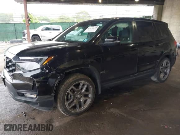 2023 Honda Passport EX-L with VIN 5FNYF8H52PB033173, listed as a IAAI auction lot 42376245 with 24,134 mi miles and . Bid and sale history available at DreamBid. Image 2.